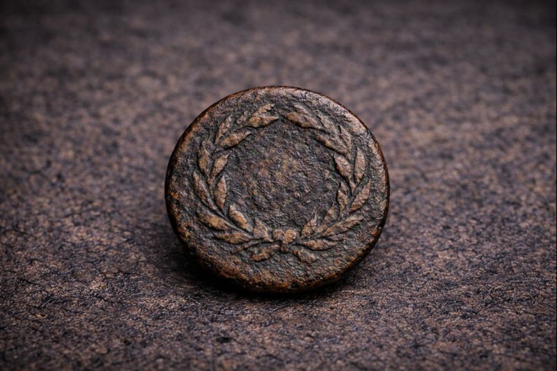 Worn Bronze Coin with Laurel Wreath