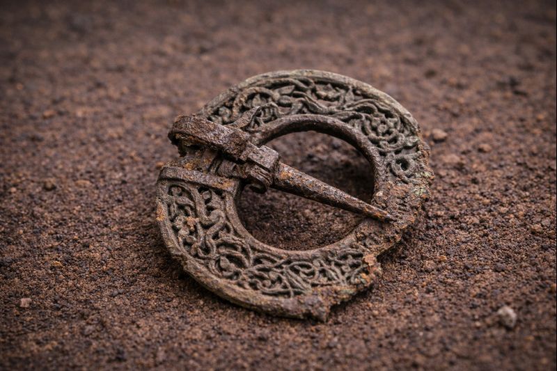 Decorated Bronze Brooch Fragment with Intricate Motif
